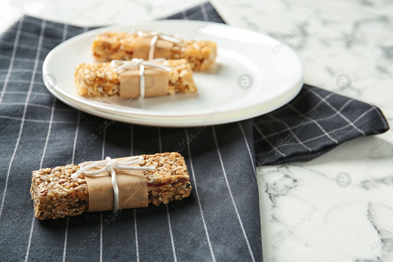 Photo of Homemade grain cereal bars on table. Healthy snack