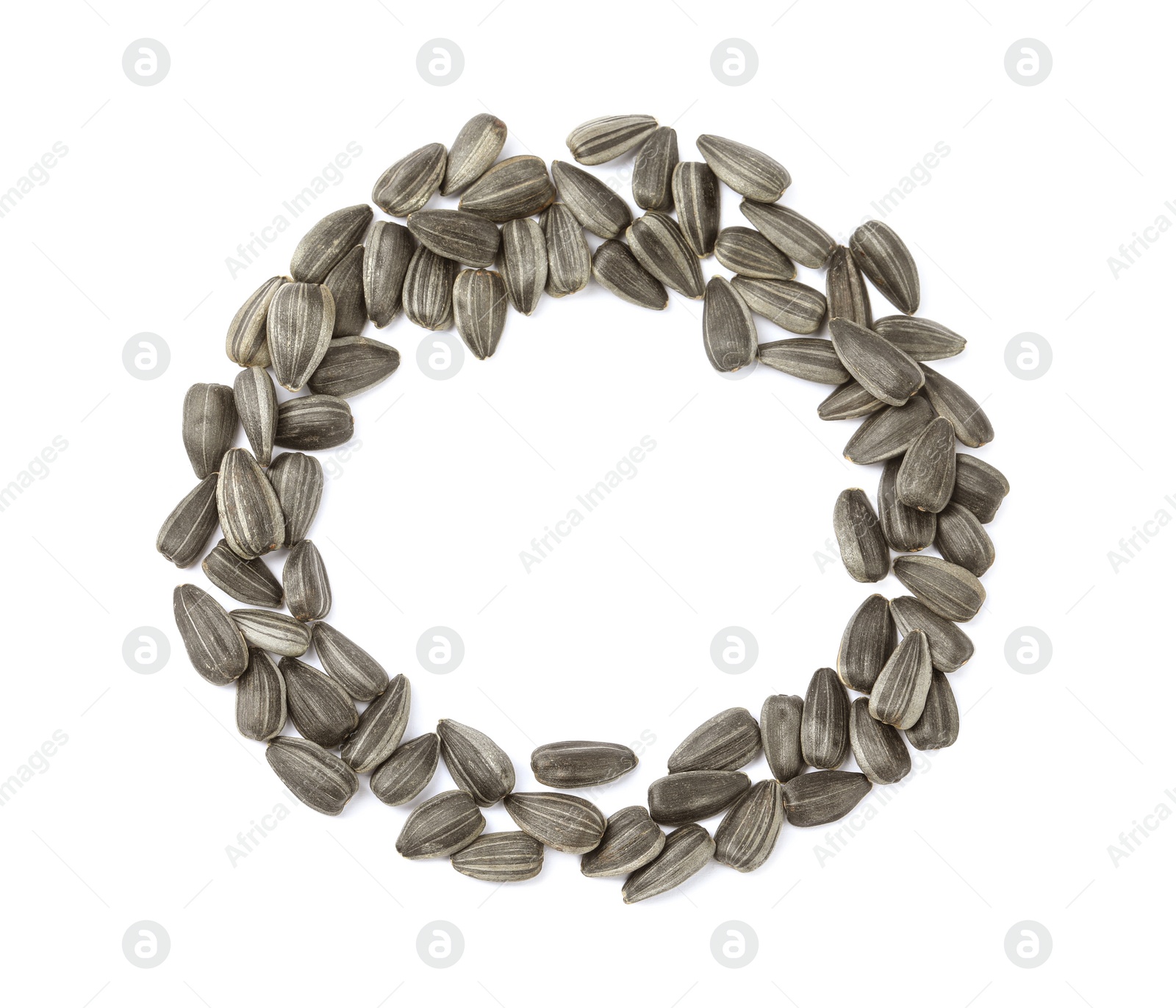 Photo of Raw sunflower seeds on white background, top view