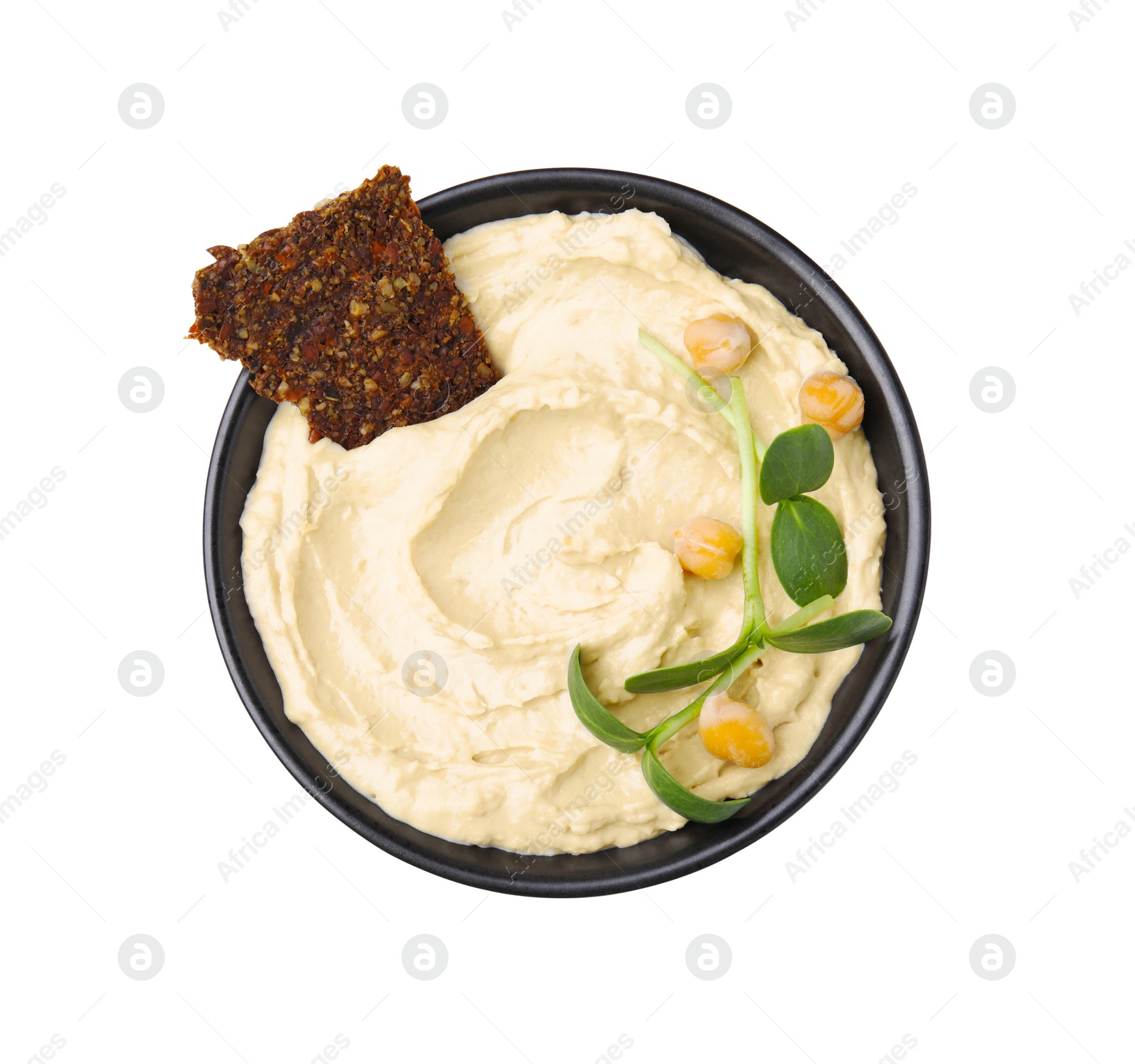 Photo of Bowl of delicious hummus with crispbread and chickpeas isolated on white, top view