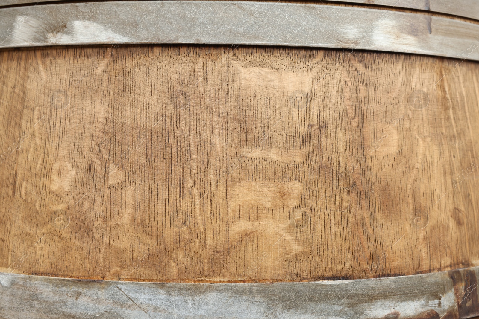 Photo of Traditional wooden barrel as background, closeup. Wine making