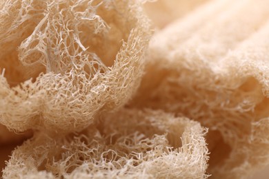 Natural loofah sponges as background, closeup view