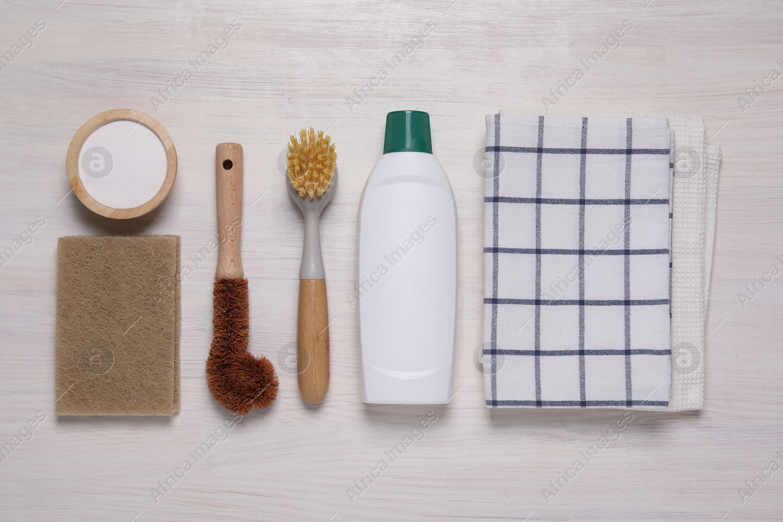 Photo of Flat lay composition with different cleaning supplies on light wooden background