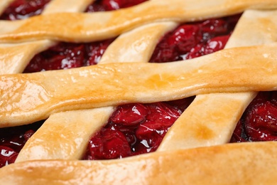 Photo of Delicious fresh cherry pie as background, closeup