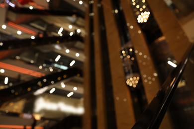 Photo of Blurred view of modern shopping mall interior. Bokeh effect