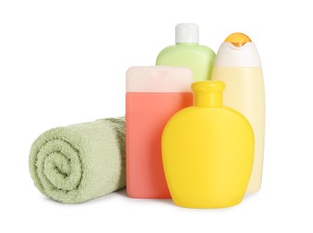 Photo of Many different shower gel bottles and towel on white background