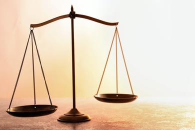 Photo of Scales of justice on table. Law concept