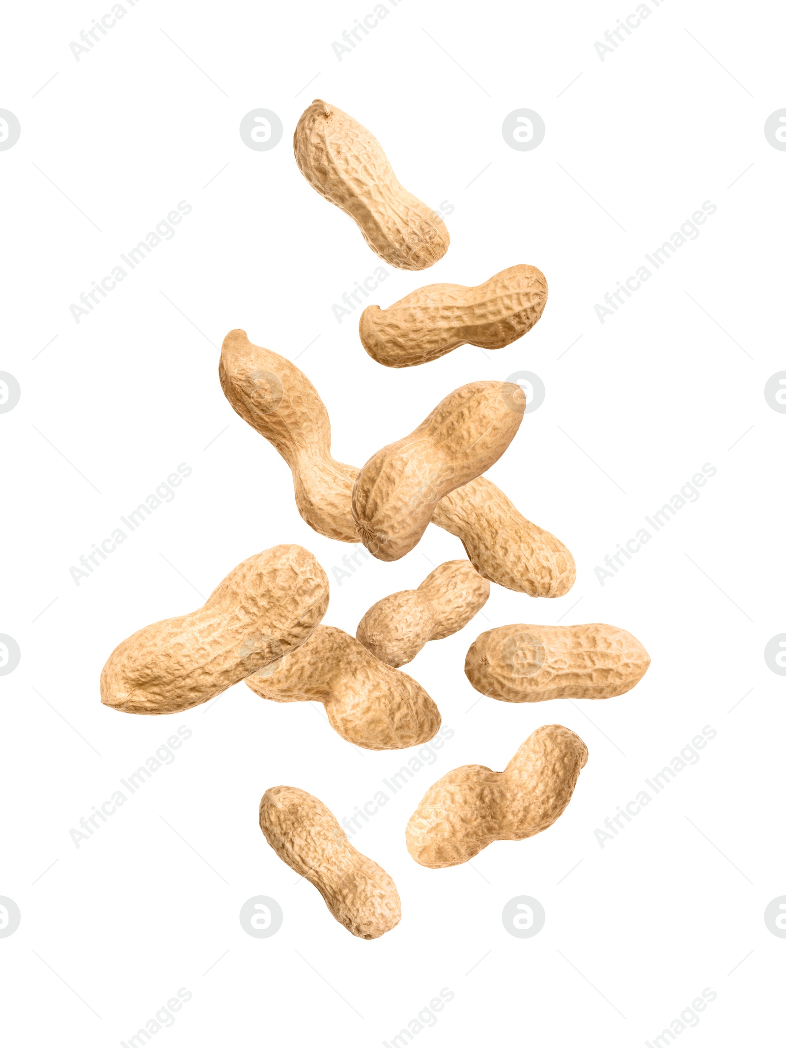 Image of Unpeeled peanuts in air on white background