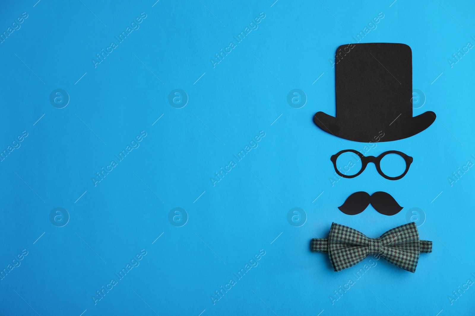 Photo of Flat lay composition with bow tie, paper decor and space for text on color background. Happy Father's Day