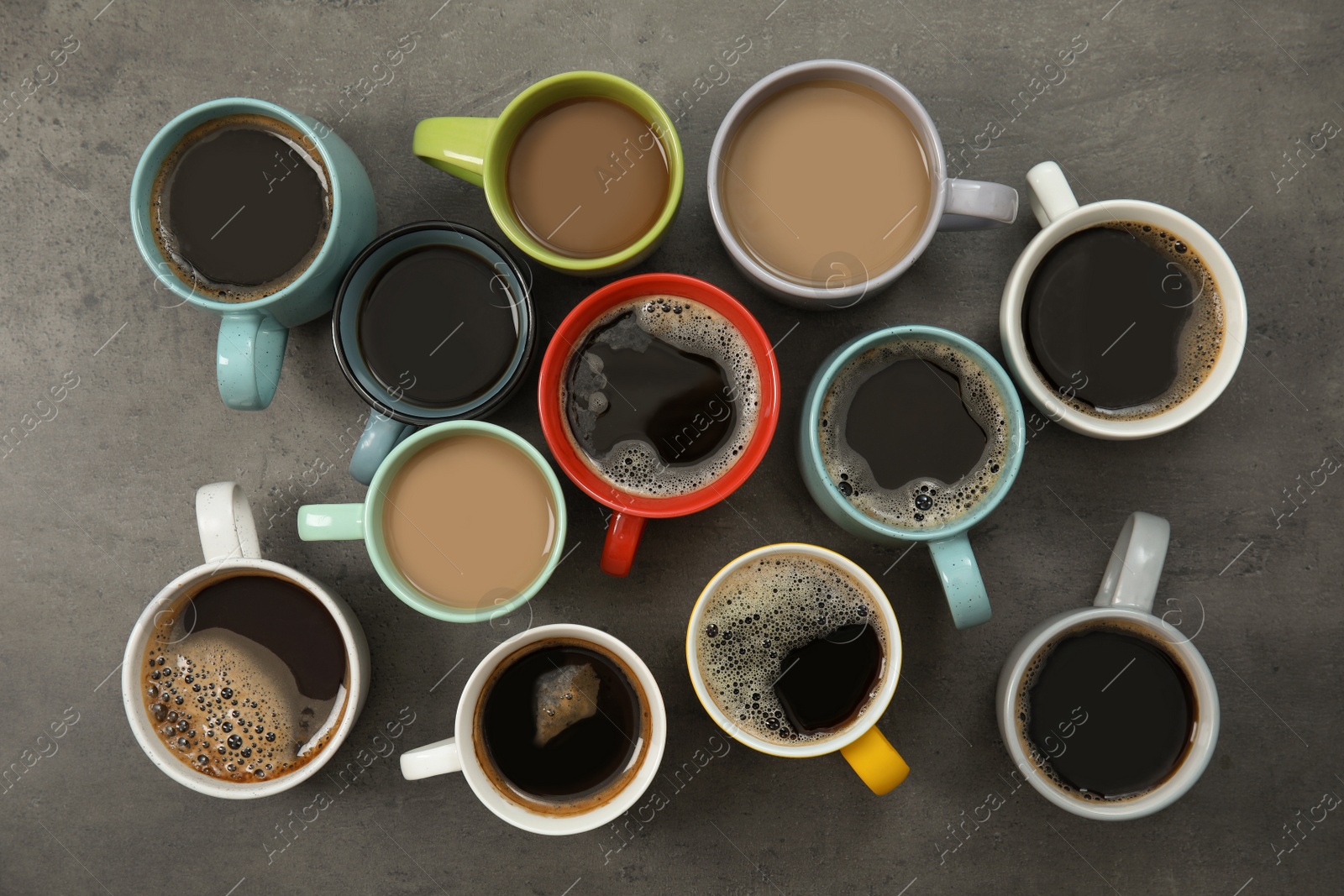 Photo of Flat lay composition with cups of coffee on gray background. Food photography