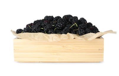 Ripe black mulberries in wooden box on white background