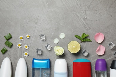 Photo of Flat lay composition with different natural deodorants and space for text on grey table