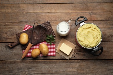 Photo of Flat lay composition with tasty mashed potatoes and ingredients on wooden table