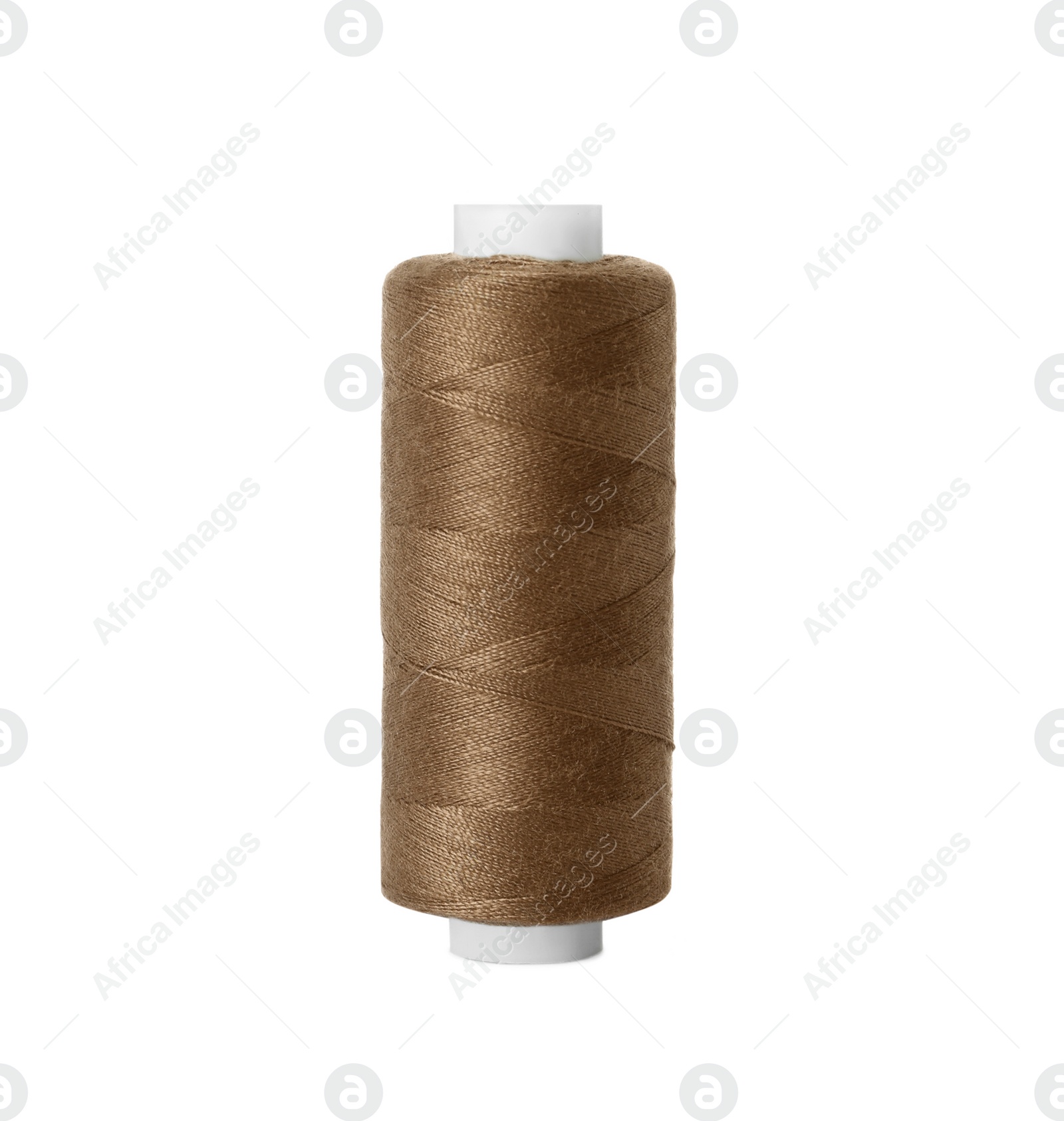 Photo of Spool of brown sewing thread isolated on white