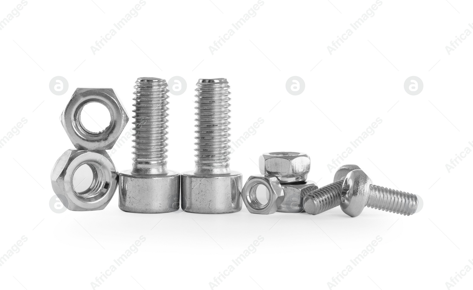 Photo of Different metal bolts and nuts on white background