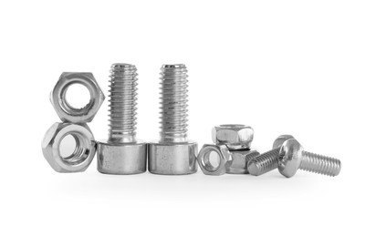 Photo of Different metal bolts and nuts on white background