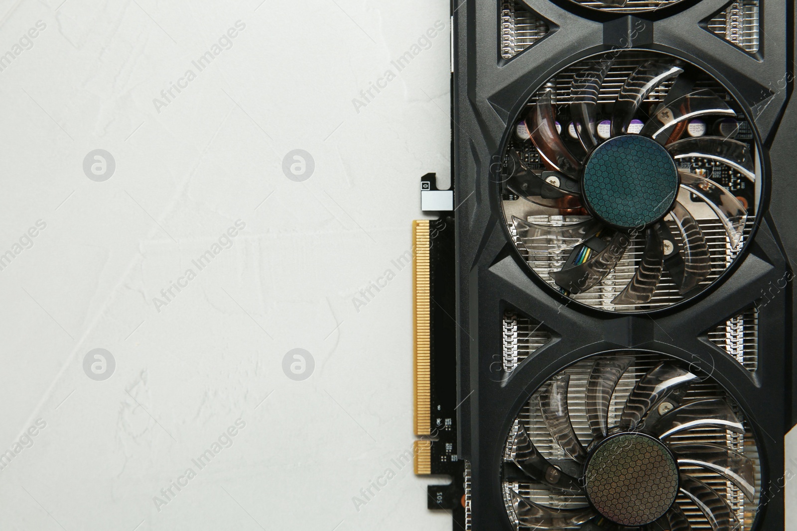 Photo of Computer graphics card on gray textured background, top view. Space for text