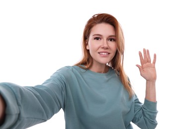 Photo of Beautiful woman taking selfie on white background