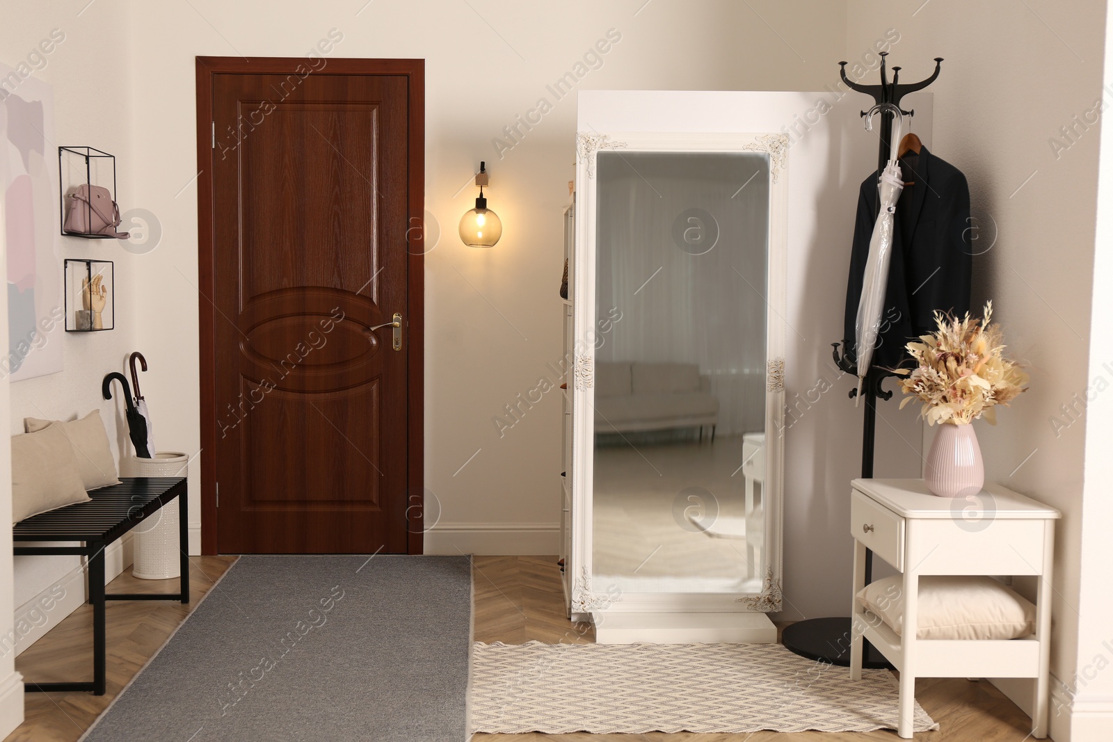 Photo of Modern hallway interior with stylish furniture and mirror