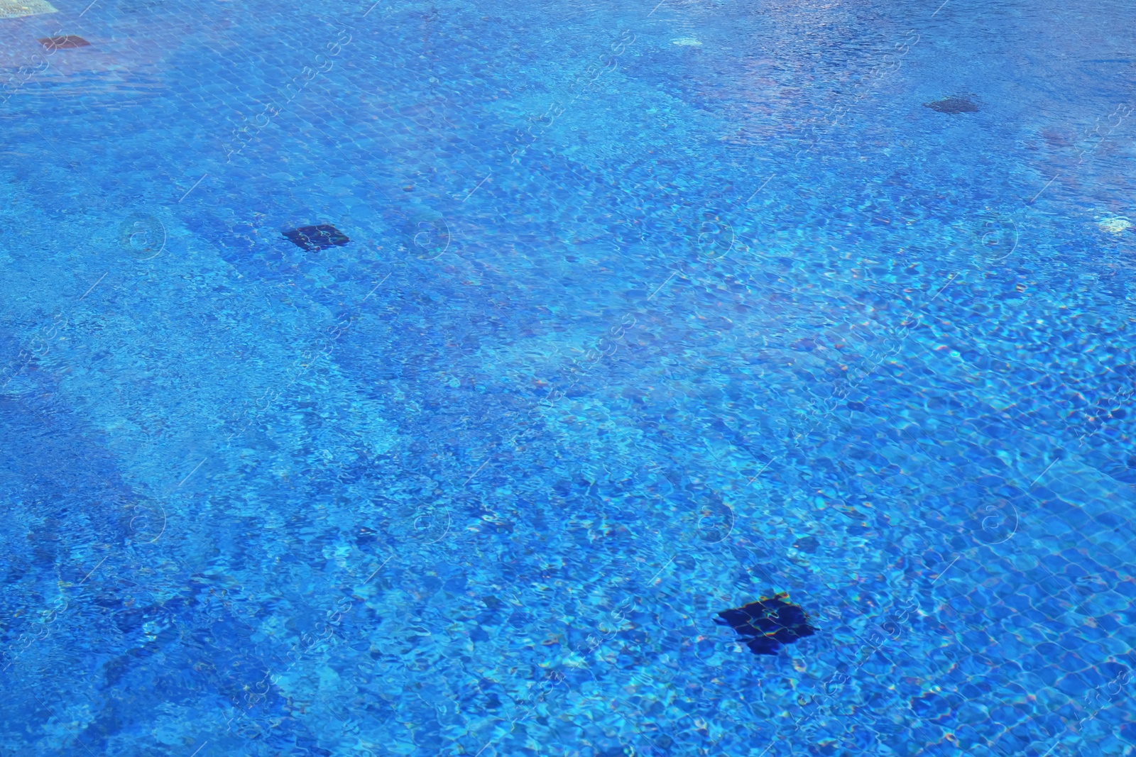 Photo of Outdoor swimming pool with clear water on sunny day