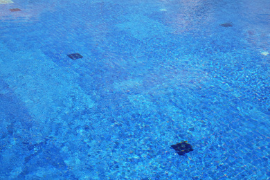 Photo of Outdoor swimming pool with clear water on sunny day