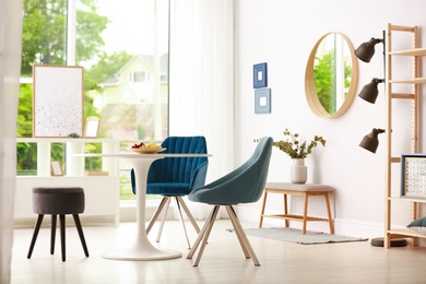 Modern dining room interior with table and chairs