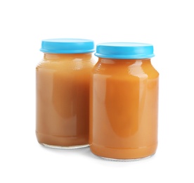 Photo of Jars with healthy baby food on white background