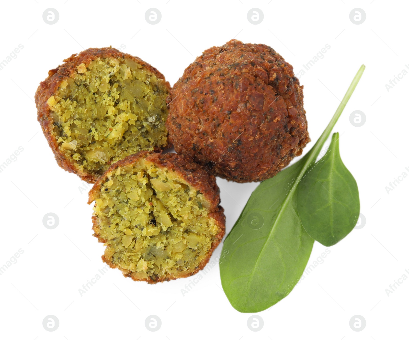 Photo of Delicious falafel balls and basil isolated on white, top view