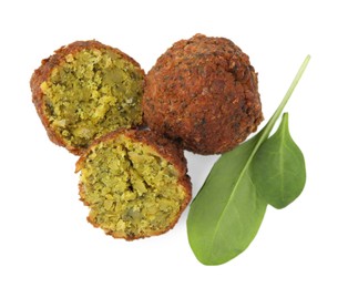 Delicious falafel balls and basil isolated on white, top view