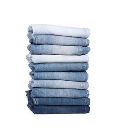 Image of Stack of different folded jeans isolated on white