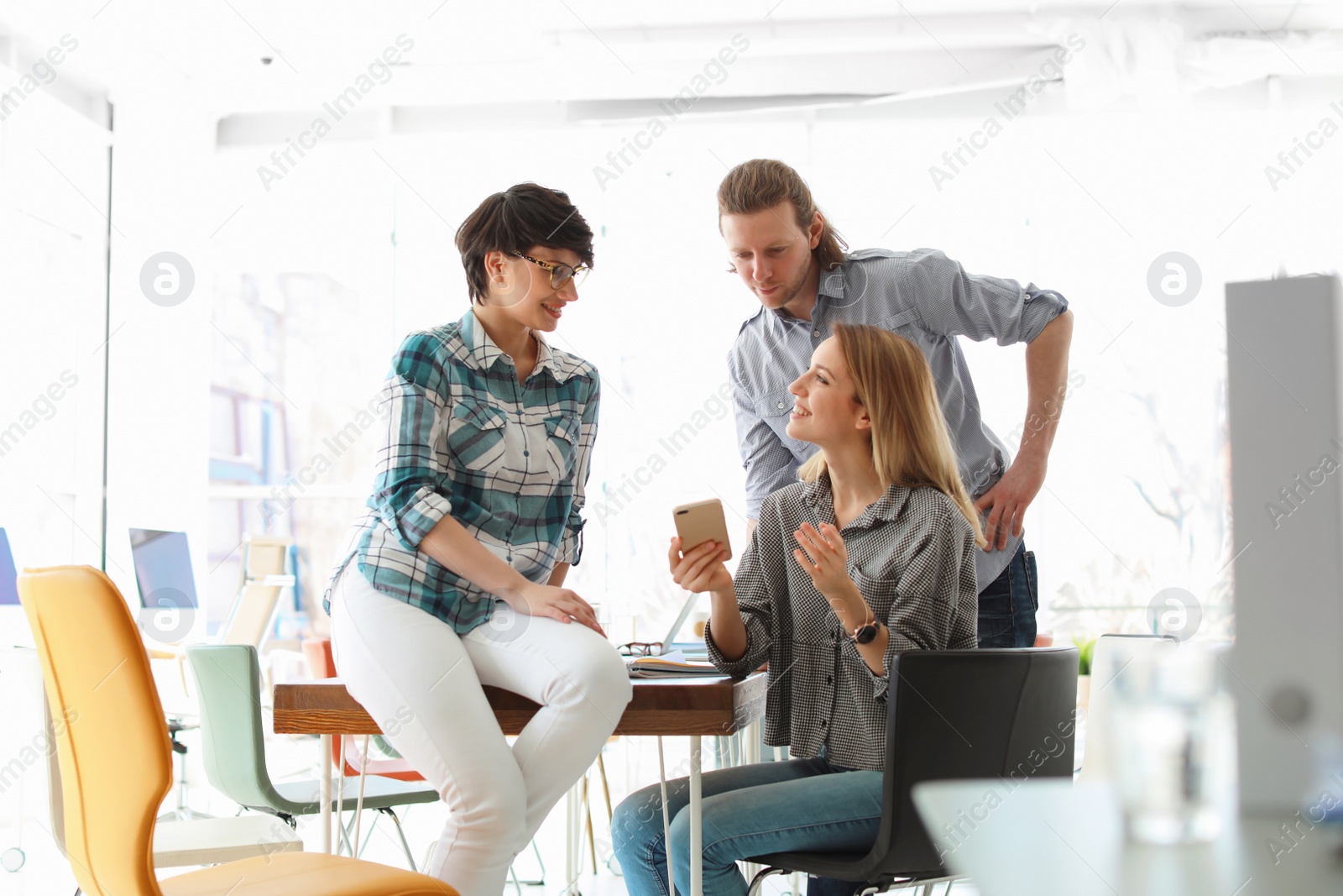 Photo of Young people having business training in office