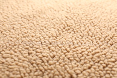 Photo of Texture of light brown faux fur as background, closeup