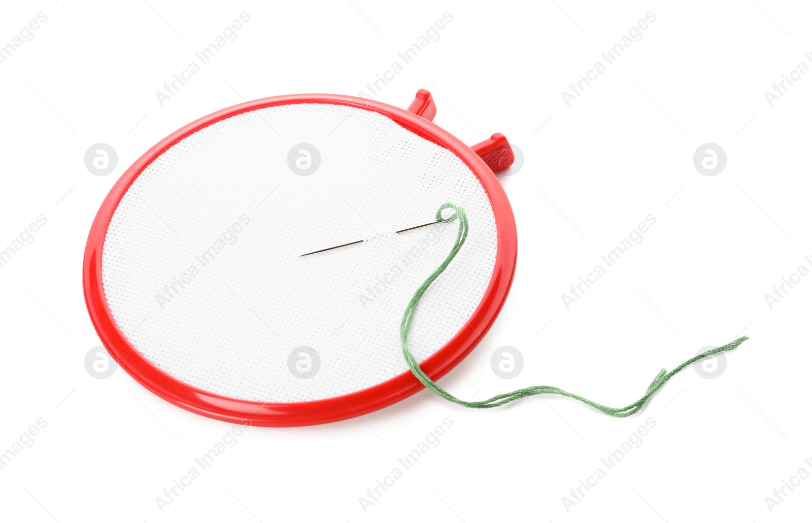 Photo of Embroidery hoop with fabric and needle on white background