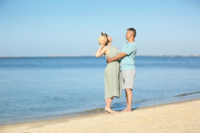 Photo of Happy mature couple at beach on sunny day
