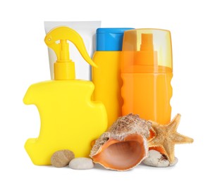 Different suntan products, starfish and seashell on white background