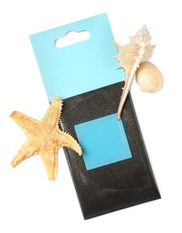 Scented sachet, starfish and sea shells on white background, top view
