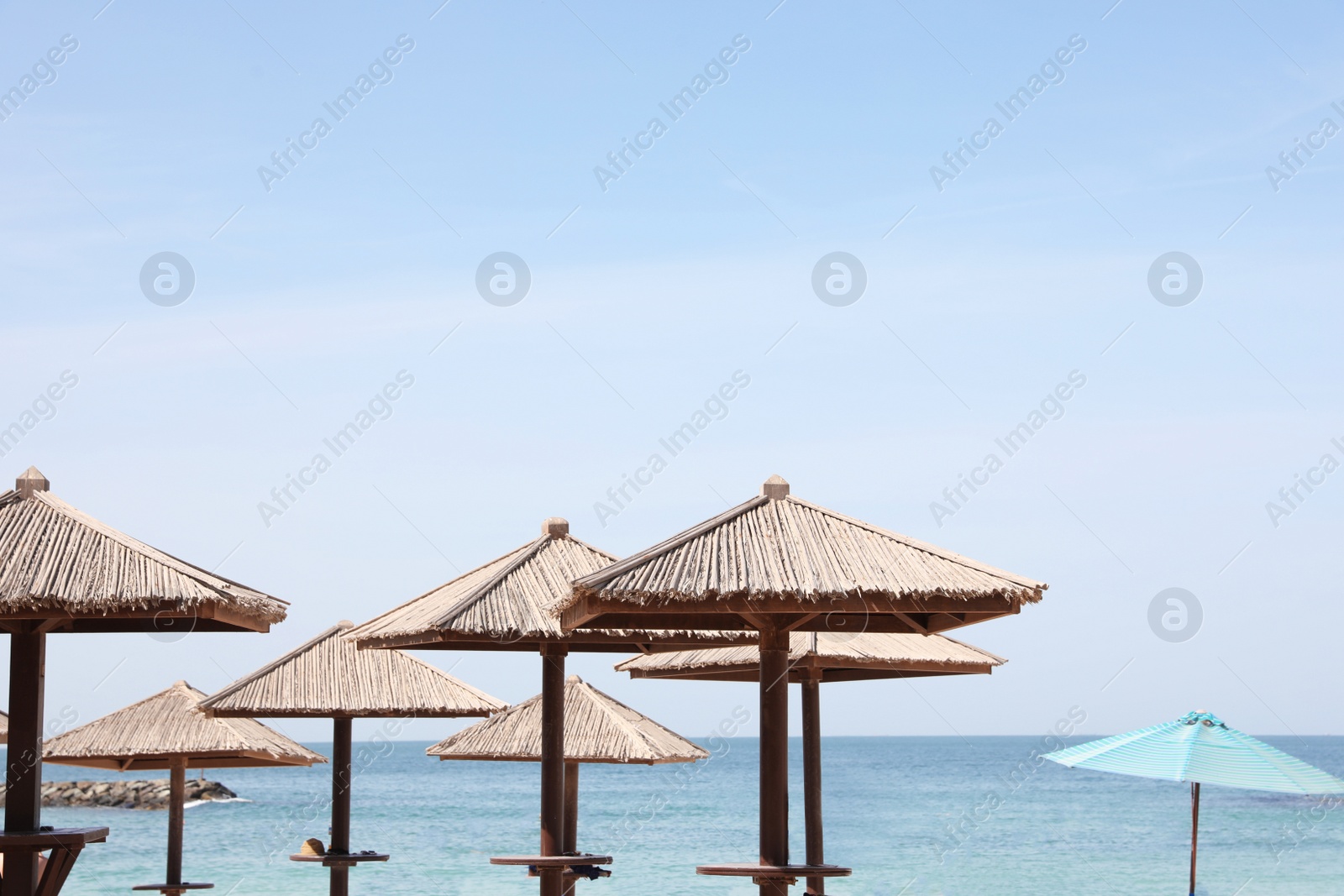 Photo of Beach umbrellas at tropical resort on sunny day
