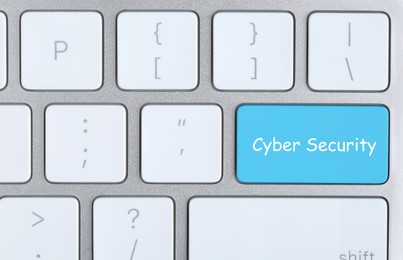 Image of Turquoise button with phrase Cyber Security on keyboard, top view