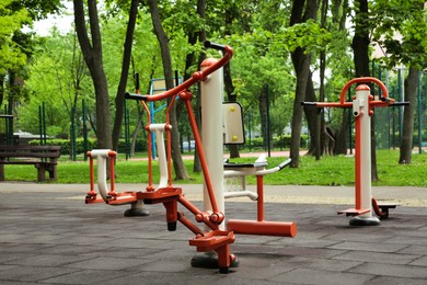 Photo of Empty outdoor gym with steppers, twister and surfer