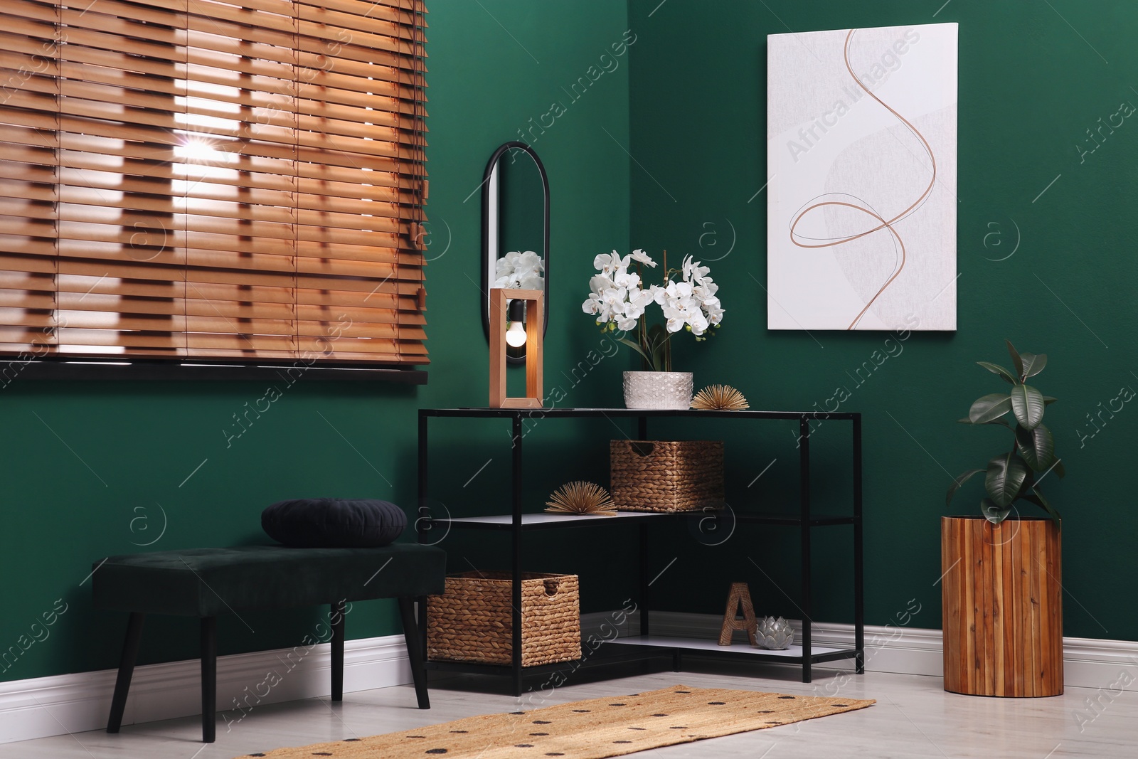 Photo of Modern hallway interior with beautiful orchid flower on console table near comfortable bench