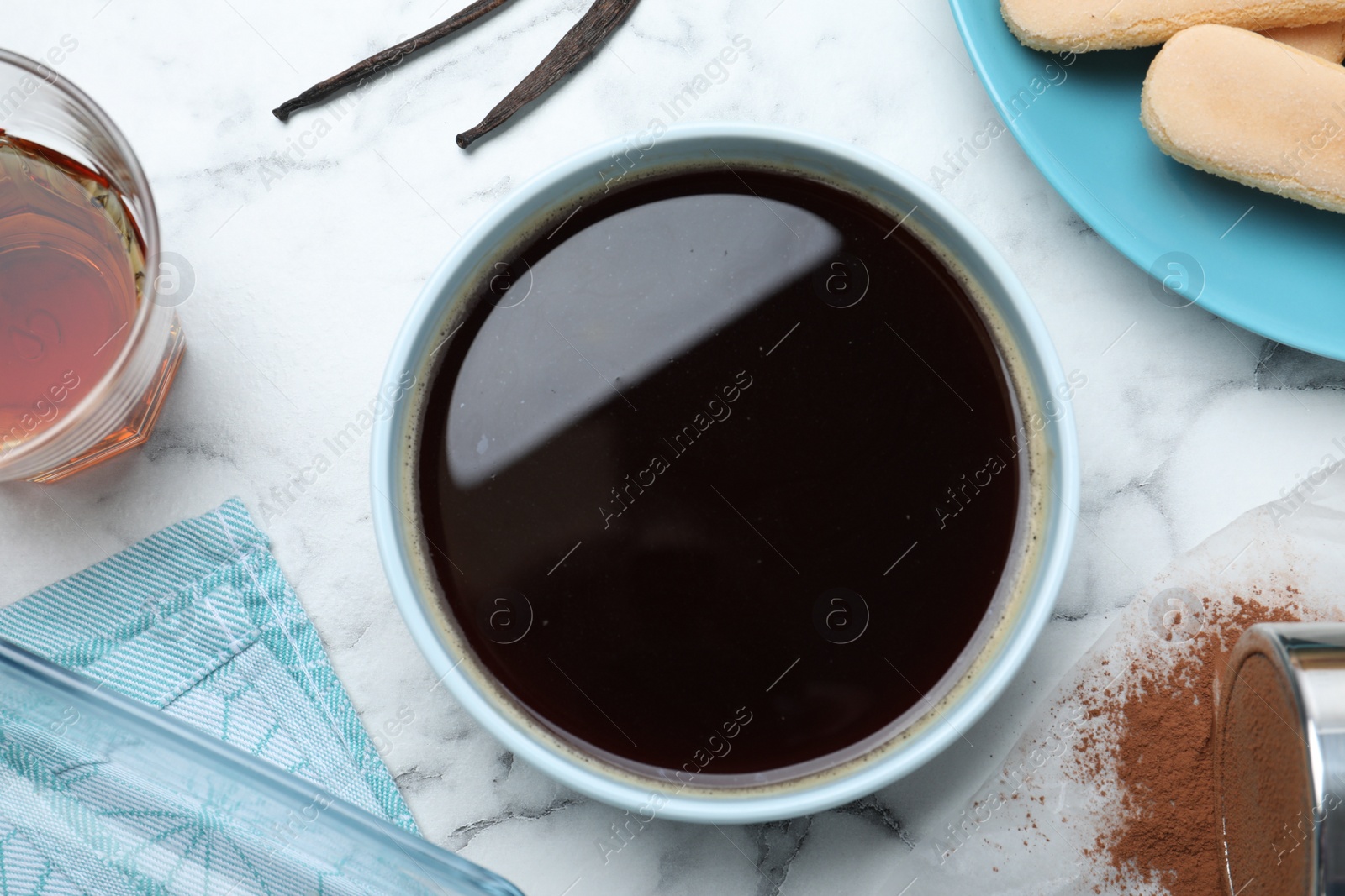 Photo of Flat lay composition with coffee and other tiramisu ingredients on white marble table