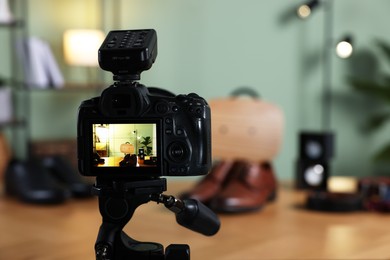 Beauty blogger's workplace. Men's accessories on table indoors, focus on camera