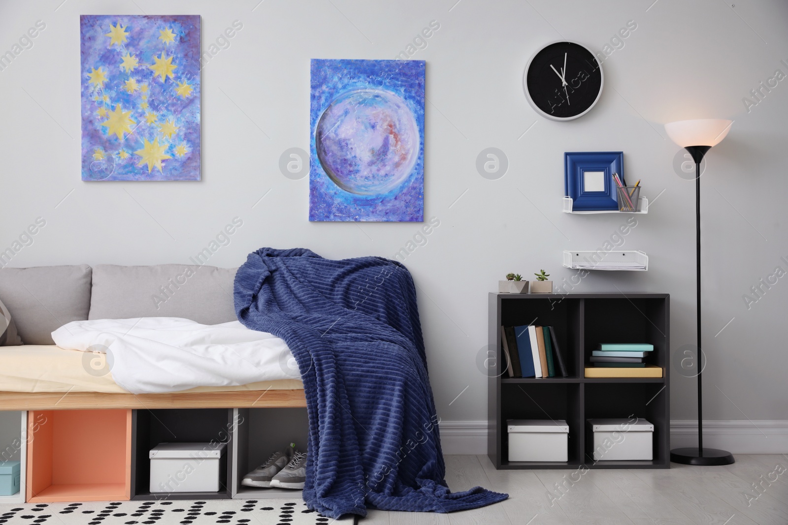 Photo of Modern teenager's room interior with comfortable bed and stylish design elements