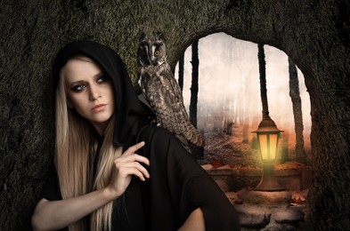 Witch wearing black mantle with owl in foggy forest. Fantasy world