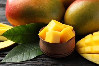 Composition with fresh mango on table, closeup