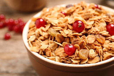 Muesli with berries in bowl, closeup. Delicious breakfast