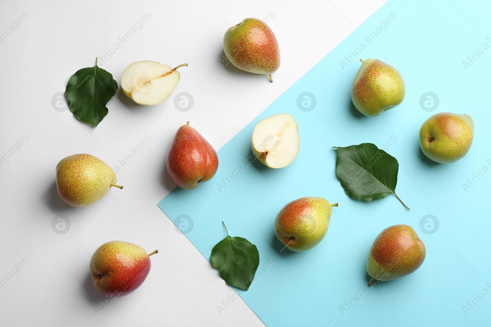 Photo of Ripe juicy pears on color background, flat lay