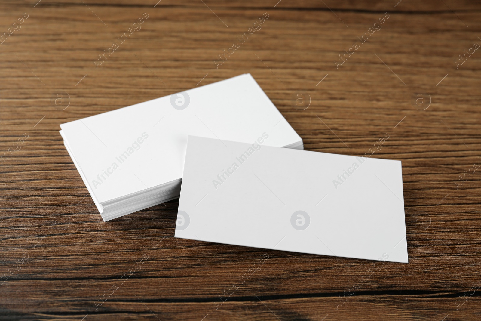 Photo of Blank business cards on wooden background. Mockup for design