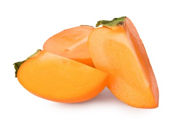 Pieces of delicious ripe juicy persimmons on white background