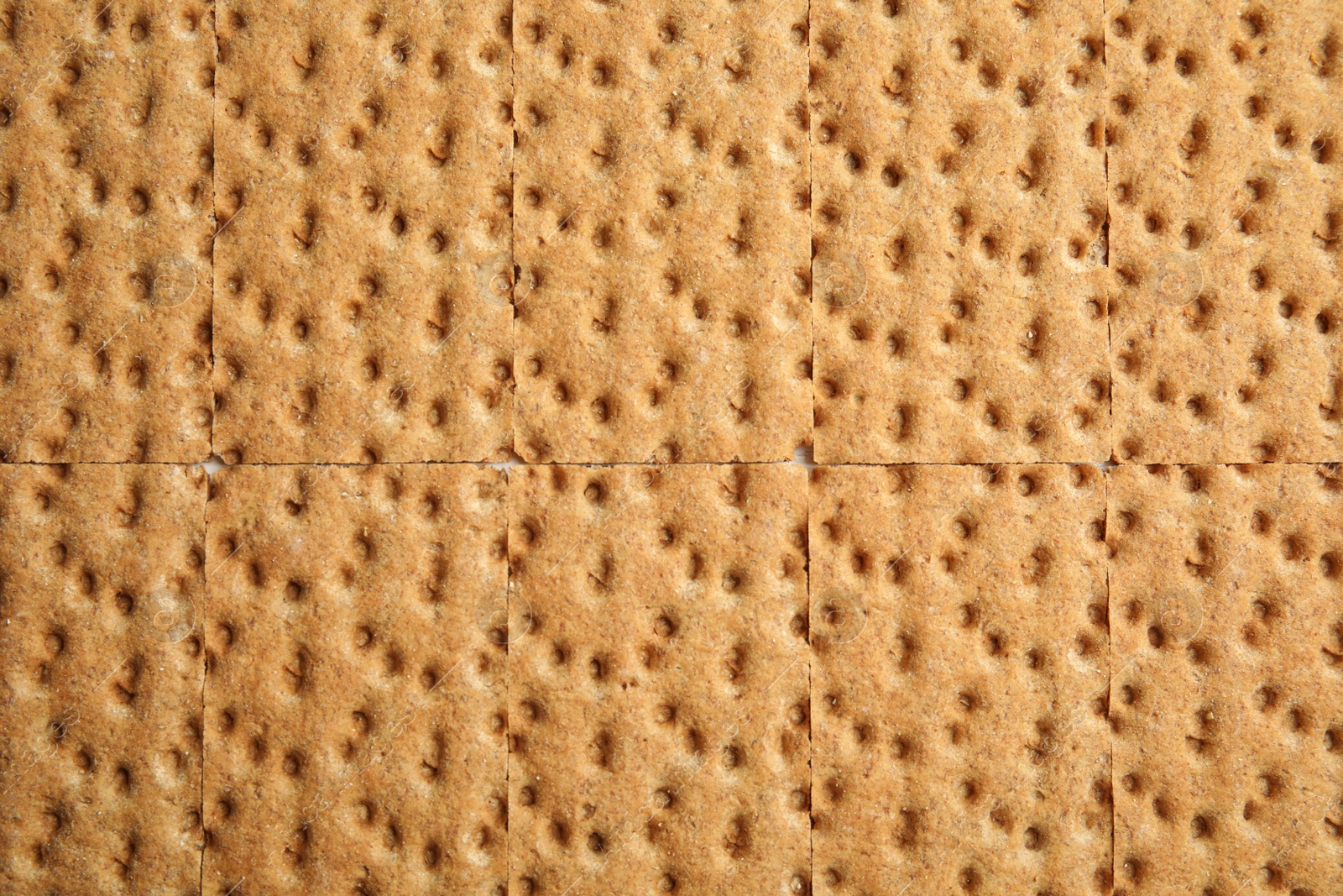 Photo of Fresh rye crispbreads as background, top view