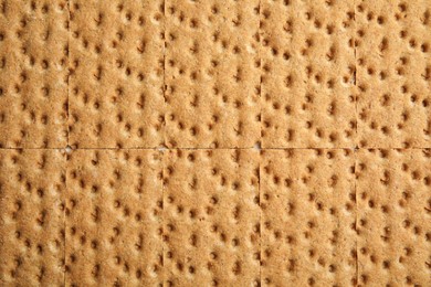 Photo of Fresh rye crispbreads as background, top view